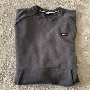 Men’s grey Nike front pocket sweatshirt.